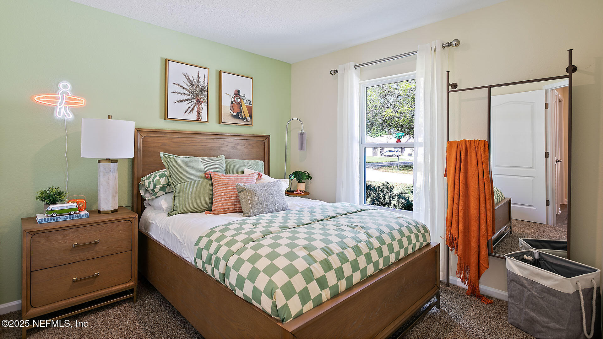 7 Ryall Lane, Unit B Palm Coast, FL 32164 - Photo 18 of 34 a bedroom with a bed and a flat tv screen on the dresser