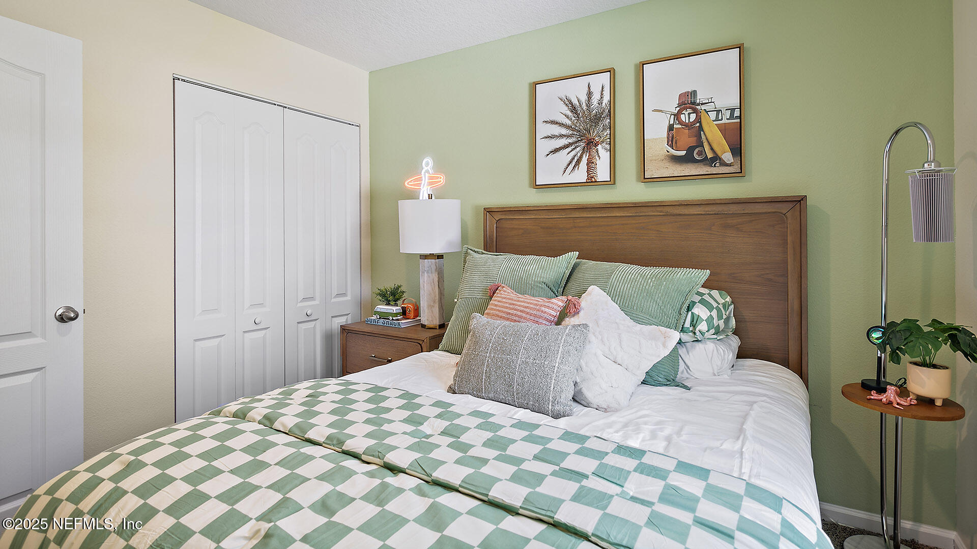 7 Ryall Lane, Unit B Palm Coast, FL 32164 - Photo 19 of 34 a bedroom with a bed and painting on the wall