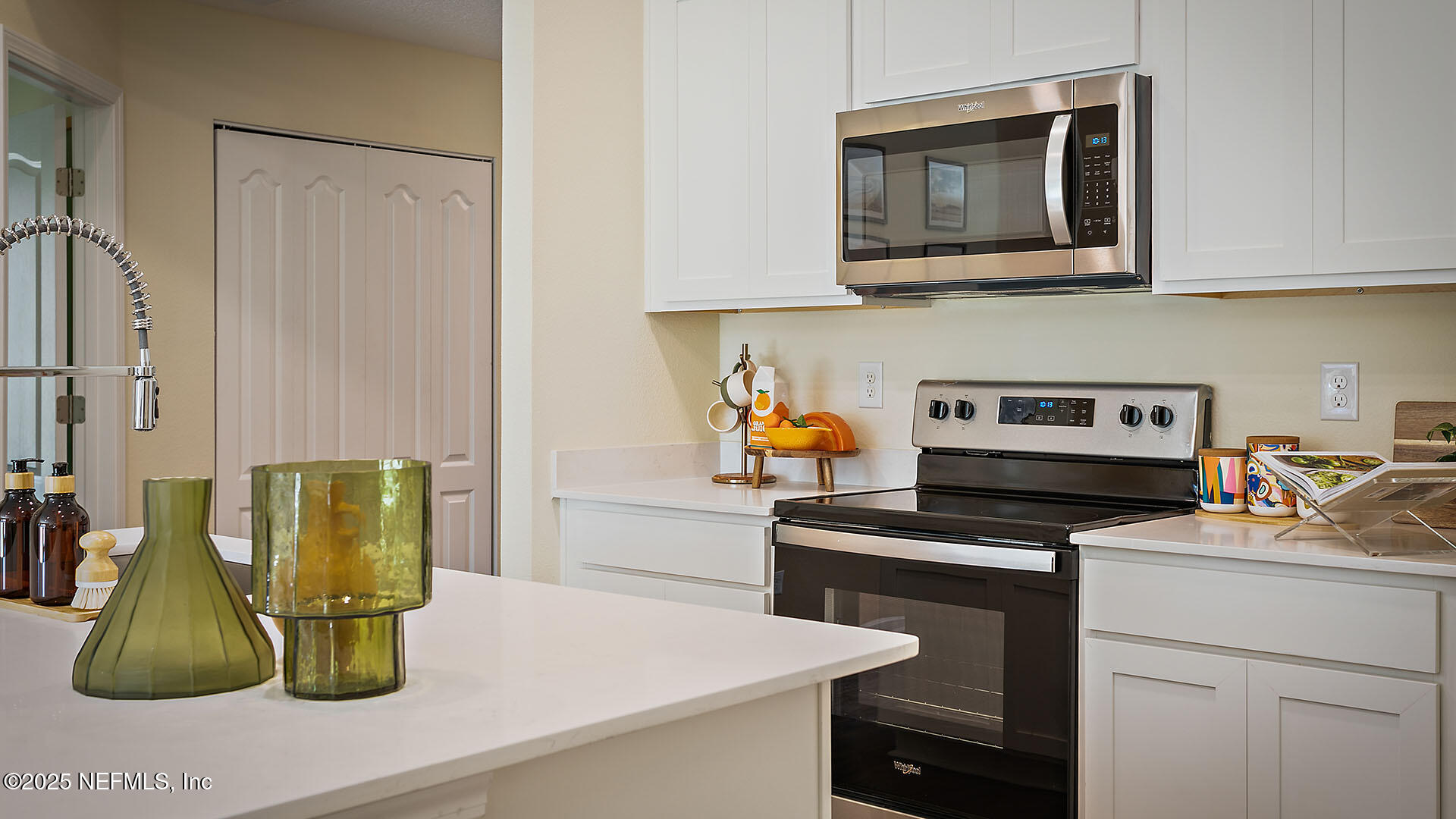 7 Ryall Lane, Unit B Palm Coast, FL 32164 - Photo 7 of 34 a kitchen with a stove and a microwave