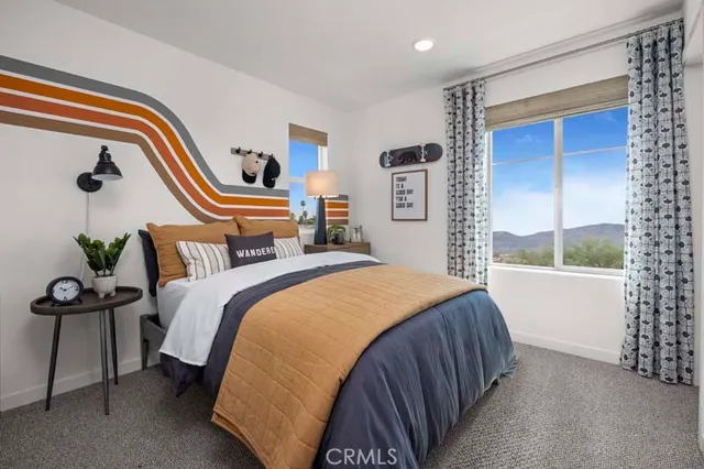 a bedroom with bed and a window