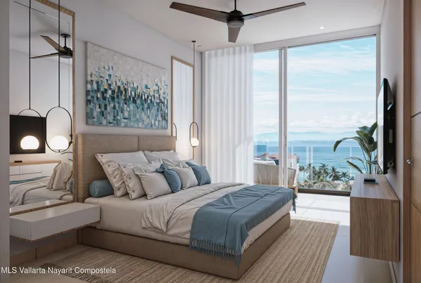 a bedroom with a large bed and a large window with wooden floor