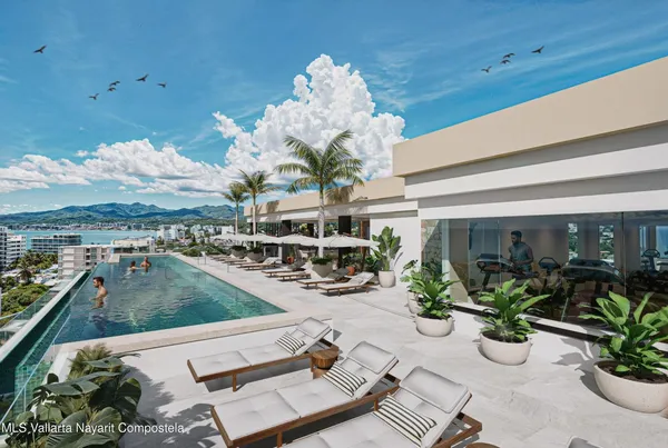 a view of hall way with furniture