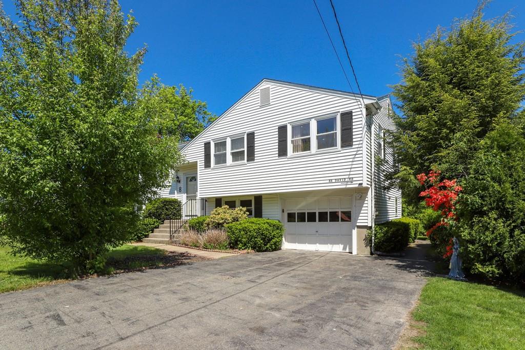 8 David Road Needham, MA 02494 - Photo 1 of 35 a front view of a house with a yard and garage