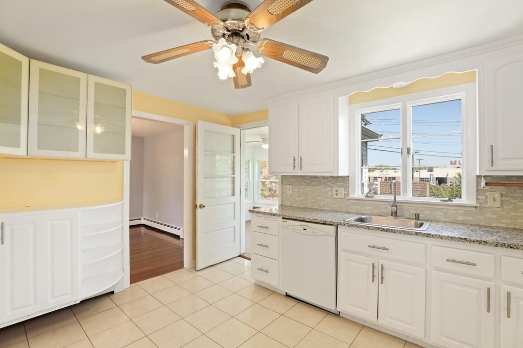 8 David Road Needham, MA 02494 - Photo 13 of 35 a kitchen with a refrigerator and a sink