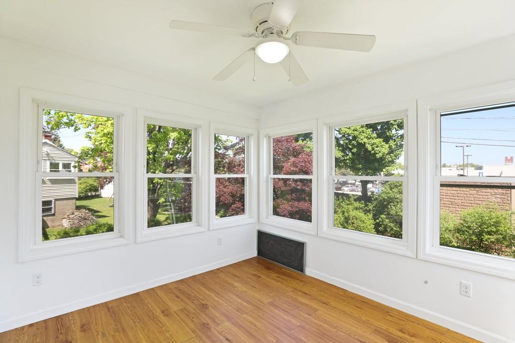 8 David Road Needham, MA 02494 - Photo 15 of 35 a view of an empty room with a window and wooden floor