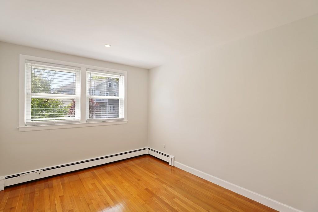 8 David Road Needham, MA 02494 - Photo 17 of 35 an empty room with wooden floor and windows