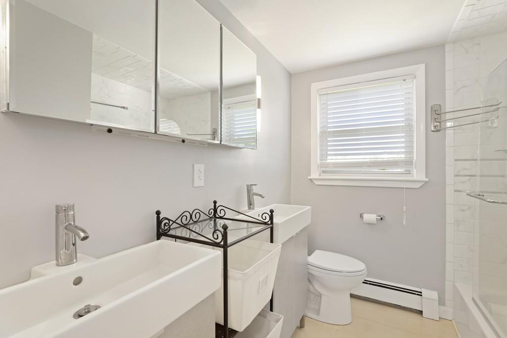 8 David Road Needham, MA 02494 - Photo 23 of 35 a bathroom with a sink a toilet and a bathtub