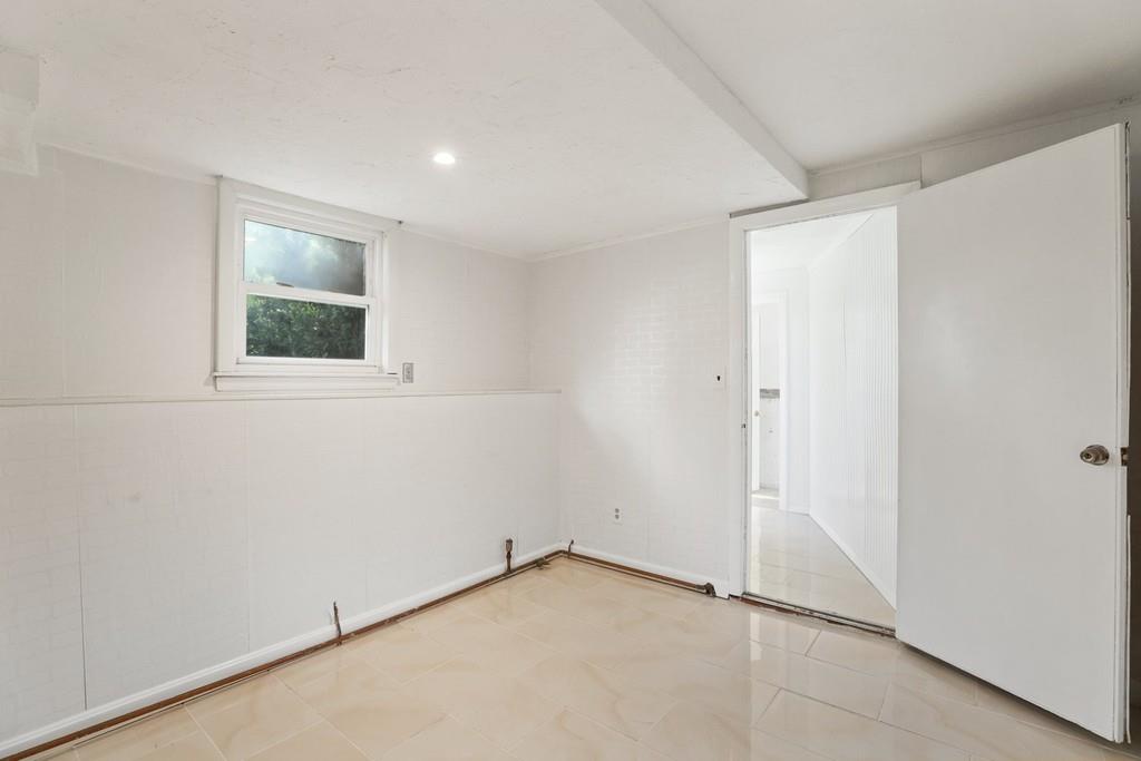 8 David Road Needham, MA 02494 - Photo 27 of 35 an empty room with a window