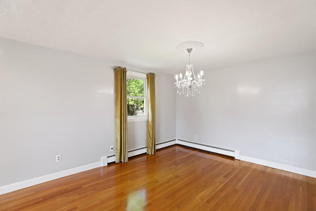 8 David Road Needham, MA 02494 - Photo 8 of 35 a view of empty room with wooden floor