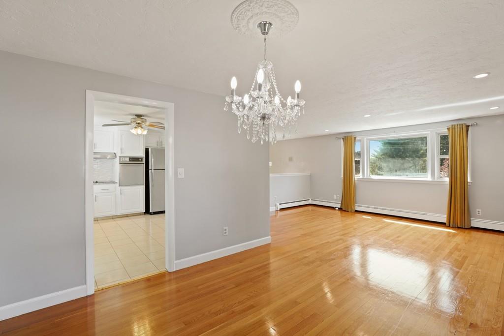 8 David Road Needham, MA 02494 - Photo 9 of 35 a view of an empty room with a window