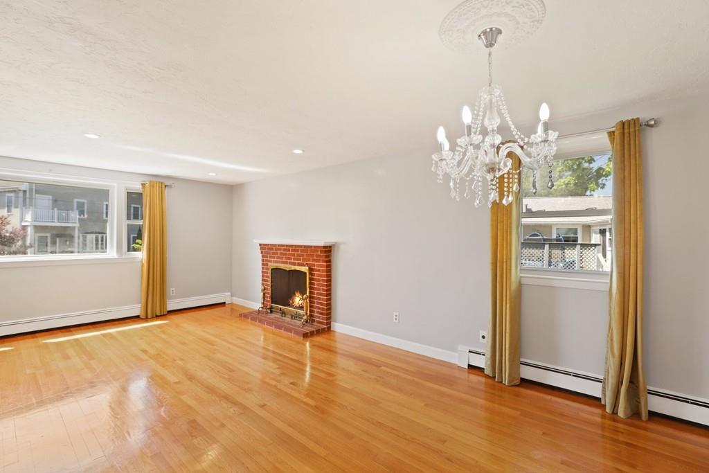 8 David Road Needham, MA 02494 - Photo 10 of 35 a view of an empty room with window and wooden floor