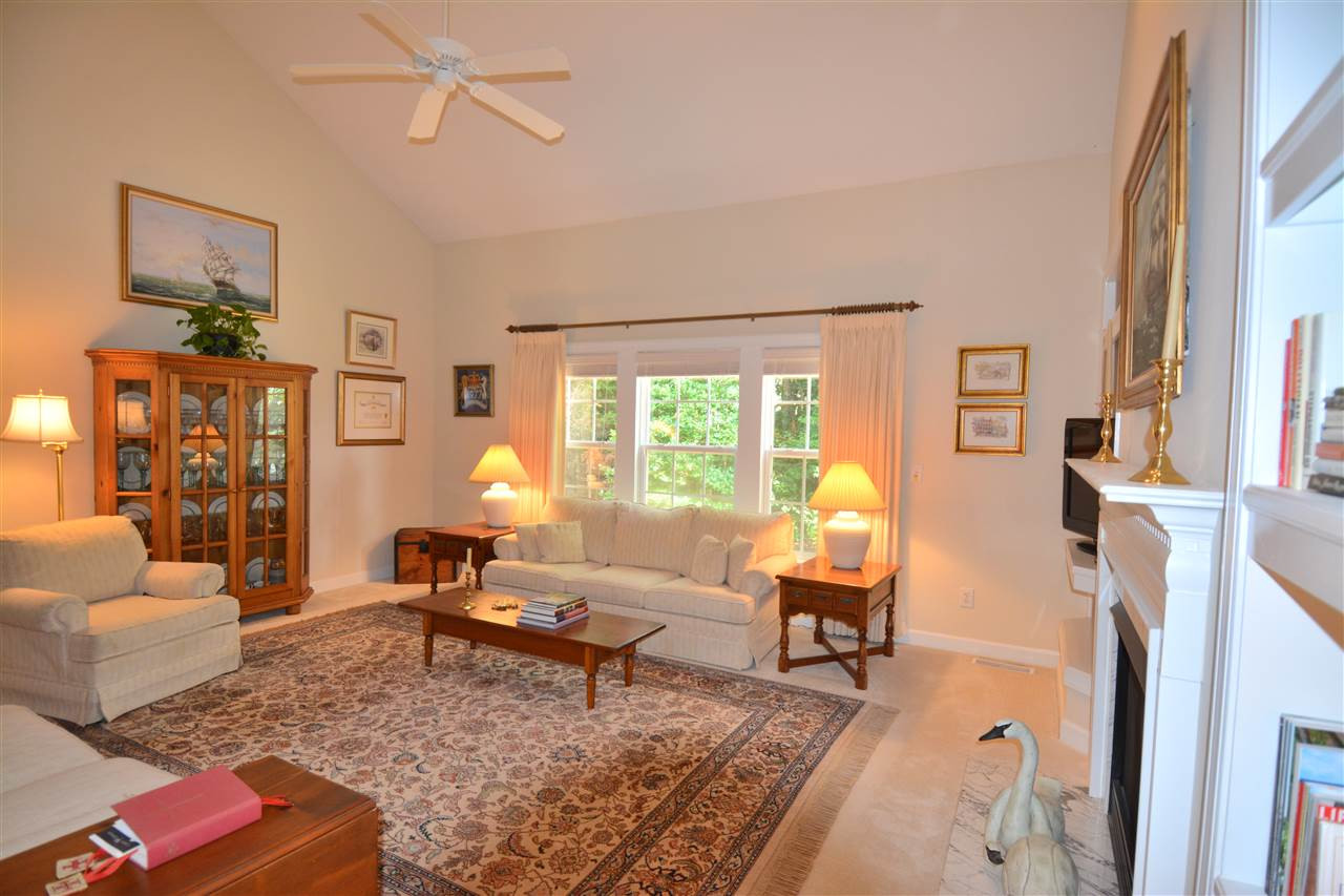 11920 Pawleys Mill Circle Raleigh, NC 27614 - Photo 4 of 21 The Family room features a vaulted ceiling with ceiling fan, gas fireplace with a marble surround, and built in bookshelves. Den/Family/Great Room