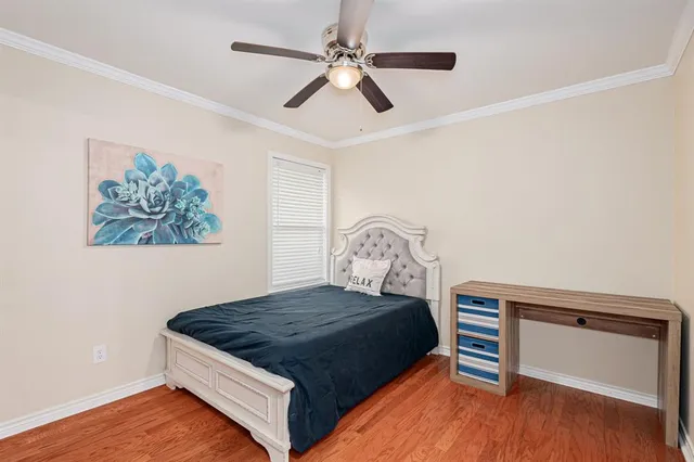 a bathroom with a granite countertop sink a toilet a mirror and shower