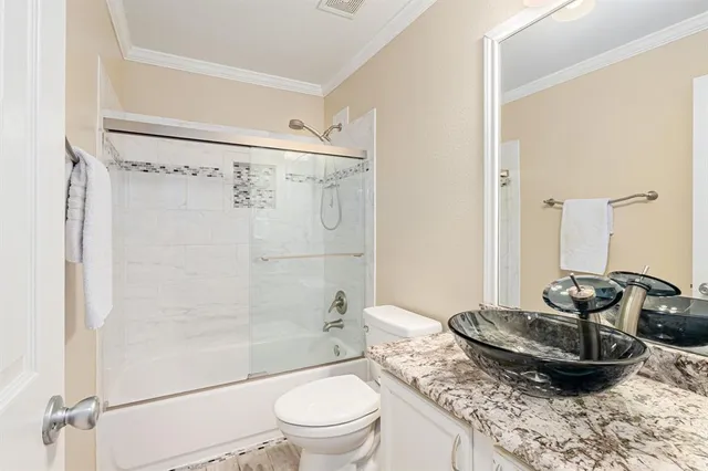 a bathroom with a sink and mirror