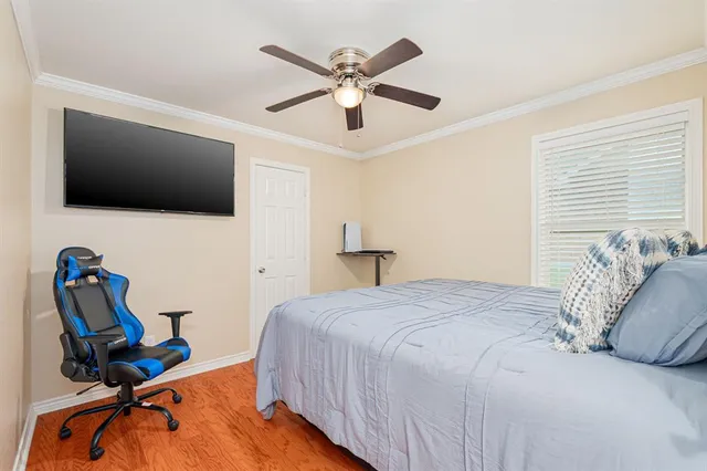 a front view of house with yard and trees in the background