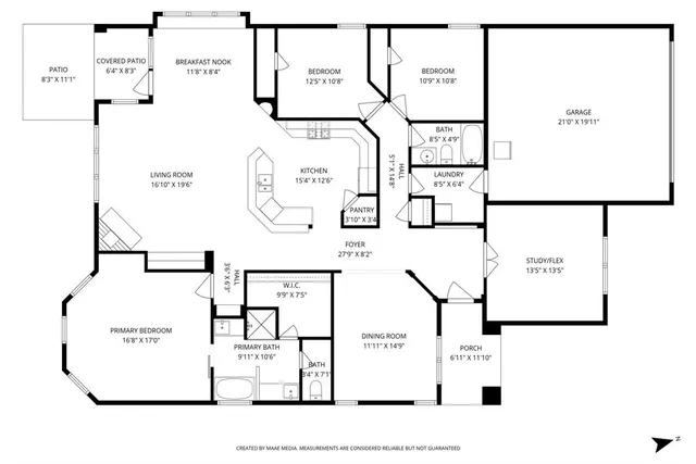 an aerial view of a house with swimming pool garden and patio