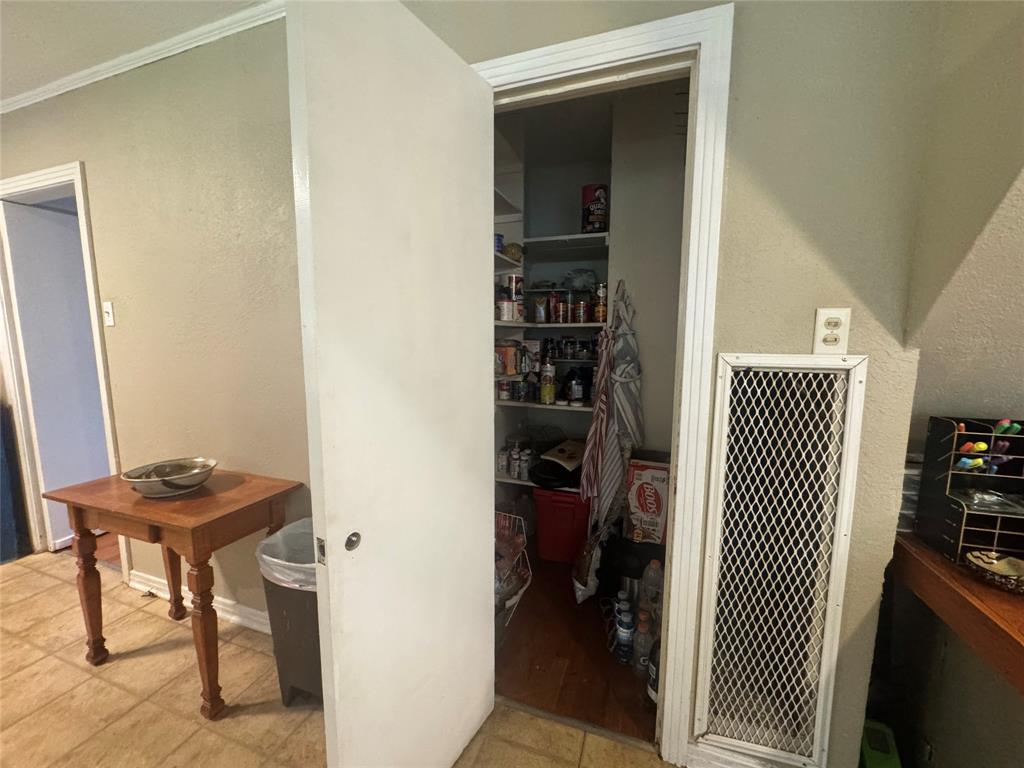 2605 West Azalea Drive Tyler, TX 75701 - Photo 13 of 25 a view of a hallway to room with wooden floor and furniture