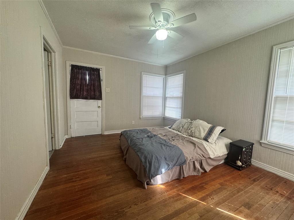 2605 West Azalea Drive Tyler, TX 75701 - Photo 15 of 25 a bed sitting in a spacious bedroom next to a window