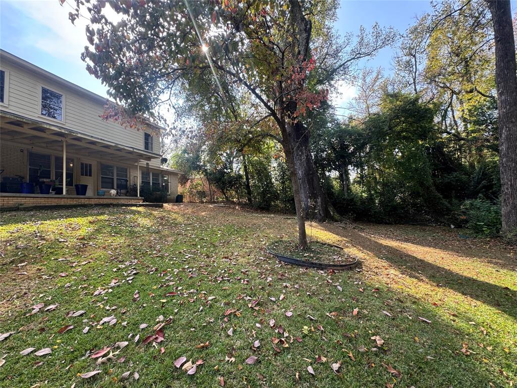 2605 West Azalea Drive Tyler, TX 75701 - Photo 23 of 25 a view of a house with a yard