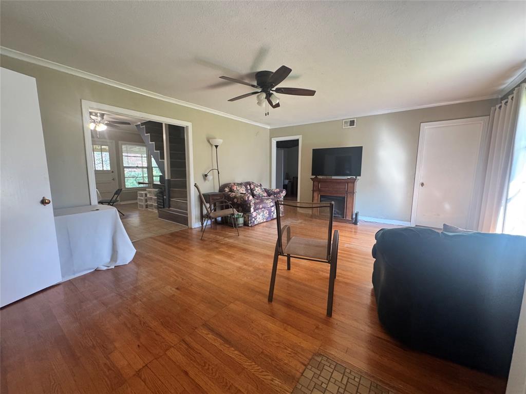 2605 West Azalea Drive Tyler, TX 75701 - Photo 4 of 25 a living room with furniture and a ceiling fan