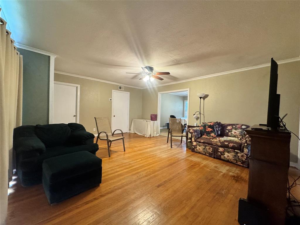 2605 West Azalea Drive Tyler, TX 75701 - Photo 5 of 25 a living room with furniture and a flat screen tv