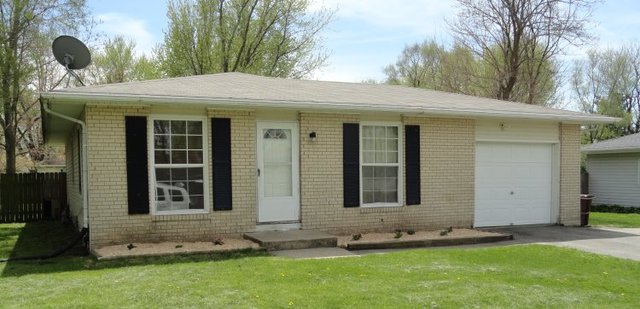 102 Roy Avenue Rochelle, IL 61068 - Photo 1 of 11 a view of a house with a yard and sitting area