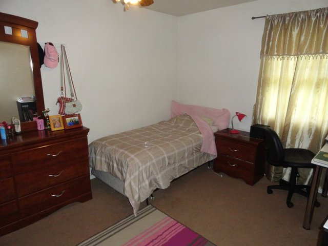 102 Roy Avenue Rochelle, IL 61068 - Photo 5 of 11 a bedroom with a bed and a dresser