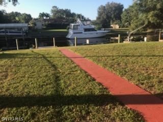 12419 River Road Fort Myers, FL 33905 - Photo 14 of 19 a view of a house with a yard