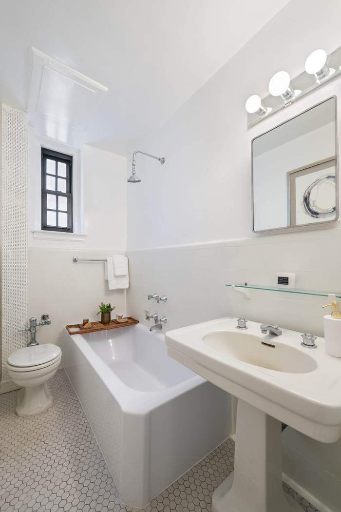 129 East 69th Street, Unit 2/3A Manhattan, NY 10021 - Photo 9 of 12 a bathroom with a sink and a toilet