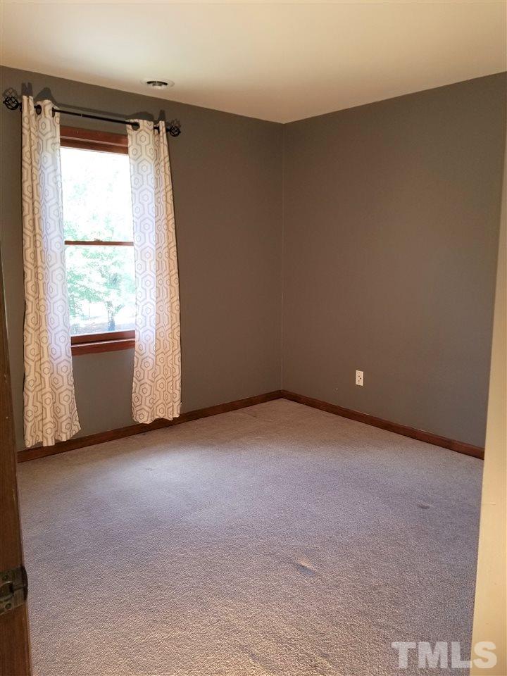 4524 Draper Road Raleigh, NC 27616 - Photo 13 of 20 an empty room with a window