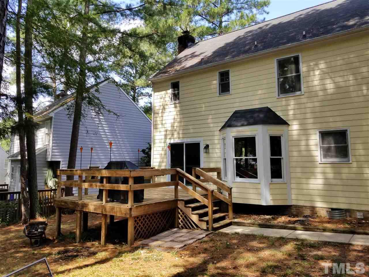 4524 Draper Road Raleigh, NC 27616 - Photo 16 of 20 a view of a house with a yard and furniture