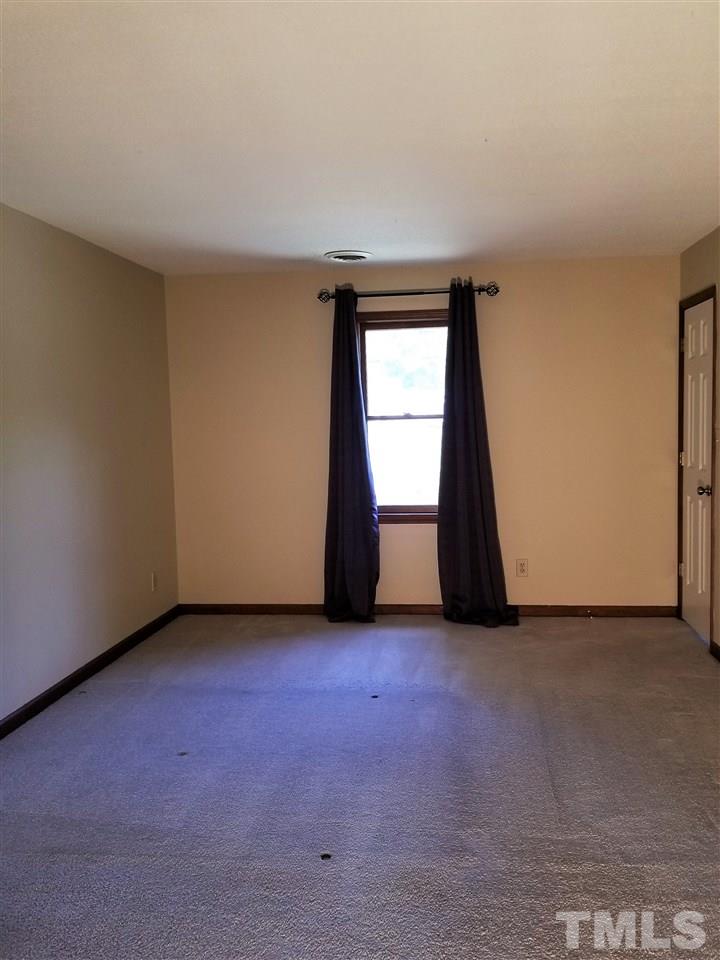 4524 Draper Road Raleigh, NC 27616 - Photo 10 of 20 an empty room with windows