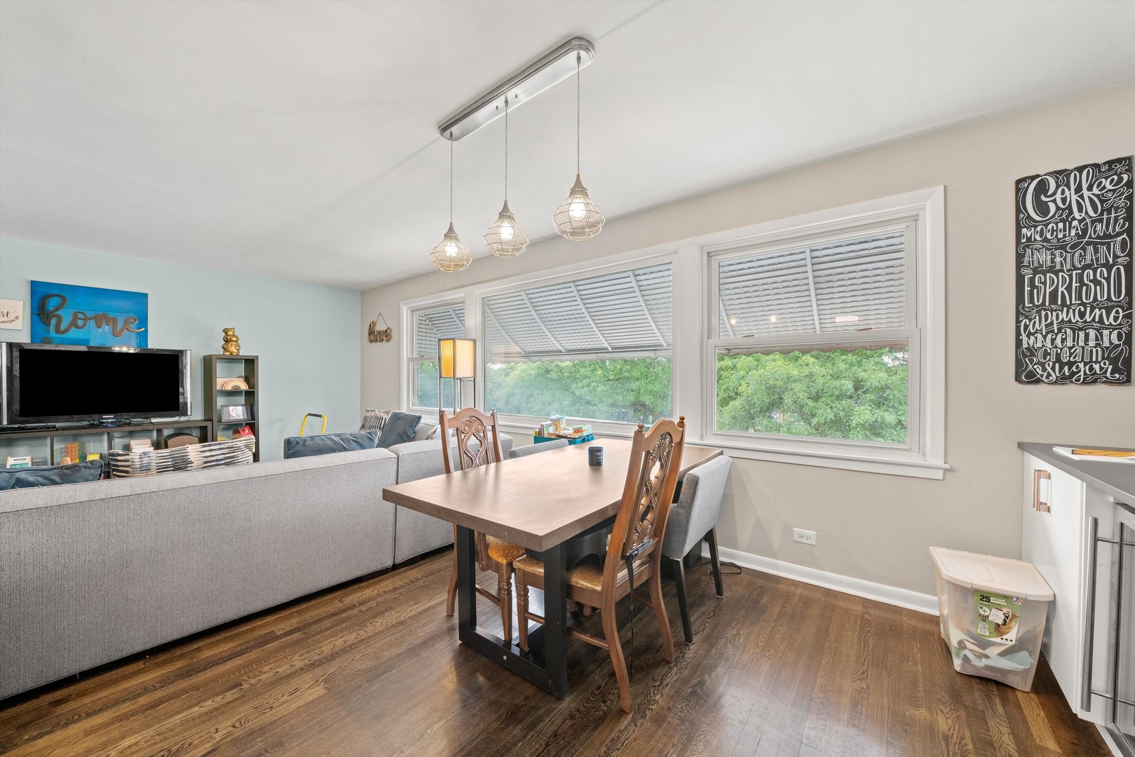 8819 North Wisner Street, Unit 2 Niles, IL 60714 - Photo 6 of 22 a view of a dining room with furniture window and wooden floor