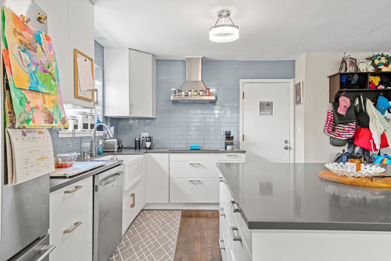 8819 North Wisner Street, Unit 2 Niles, IL 60714 - Photo 7 of 22 a kitchen with cabinets a sink and a stove top oven