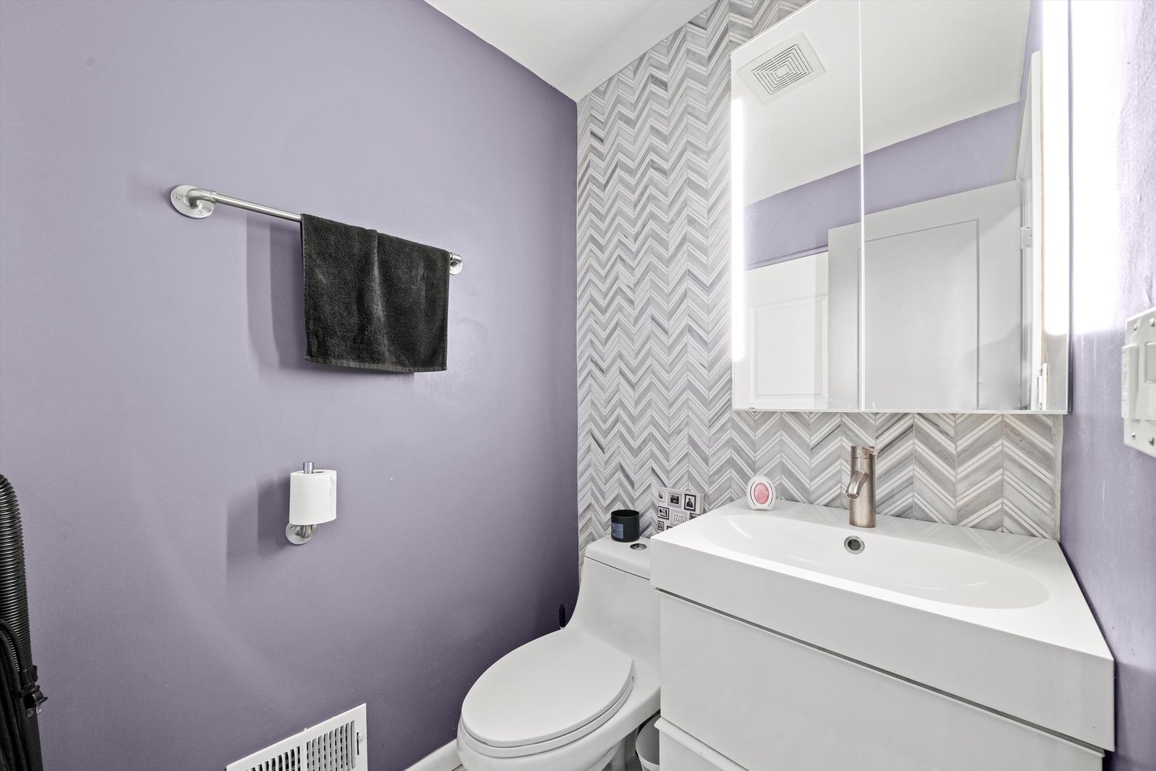 8819 North Wisner Street, Unit 2 Niles, IL 60714 - Photo 10 of 22 a bathroom with a sink a toilet a mirror and shower