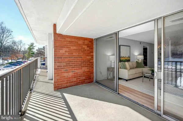 a balcony view with a glass door