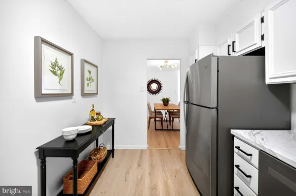 a kitchen with stainless steel appliances a refrigerator stove and microwave