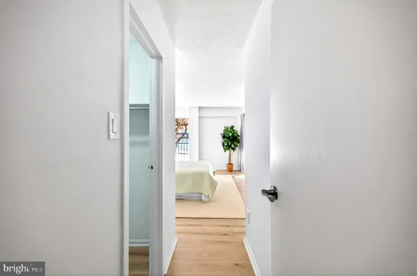 a view of a hallway with dining room and stairs