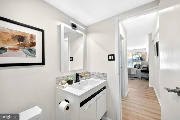 a view of a bathroom from the hallway