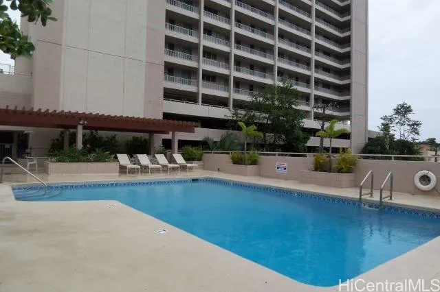 a view of a swimming pool with a patio