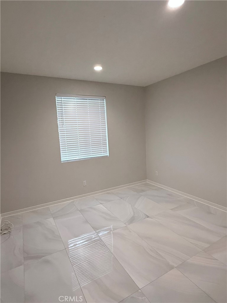 31124 Hanover Lane Menifee, CA 92584 - Photo 14 of 58 a view of an empty room with a window