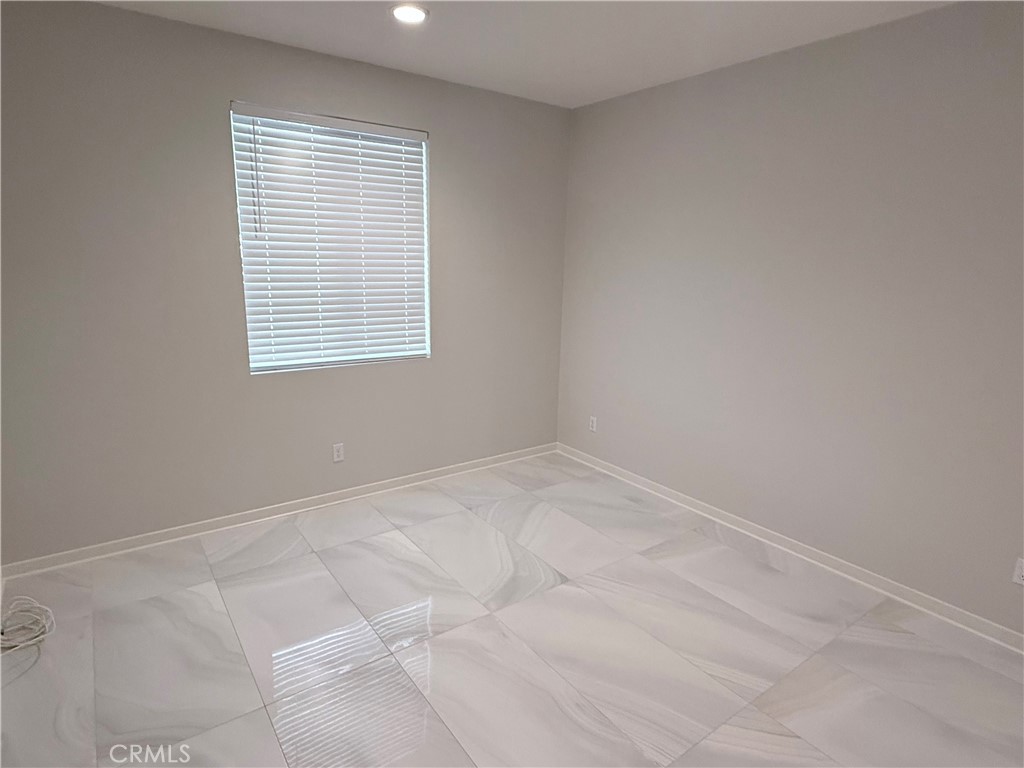 31124 Hanover Lane Menifee, CA 92584 - Photo 15 of 58 an empty room with a window