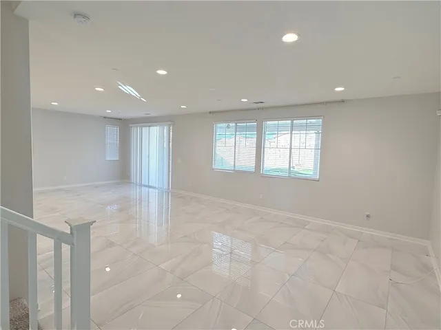 a view of a kitchen with a sink and an entryway