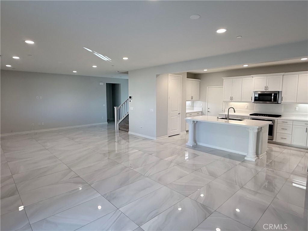 31124 Hanover Lane Menifee, CA 92584 - Photo 20 of 58 a kitchen with stainless steel appliances granite countertop a refrigerator and a stove top oven