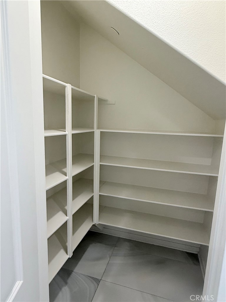 31124 Hanover Lane Menifee, CA 92584 - Photo 27 of 58 a view of room with empty cabinets and a closet