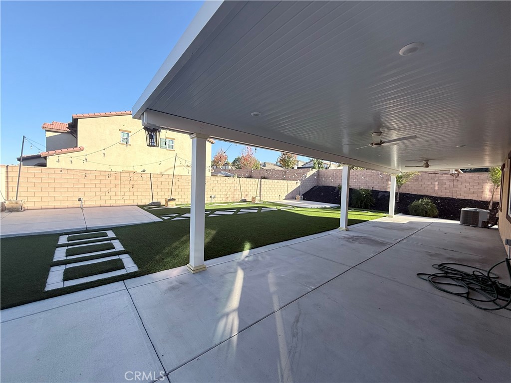 31124 Hanover Lane Menifee, CA 92584 - Photo 34 of 58 a view of a patio with wooden floor and fence