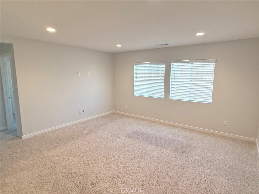 31124 Hanover Lane Menifee, CA 92584 - Photo 38 of 58 an empty room with windows