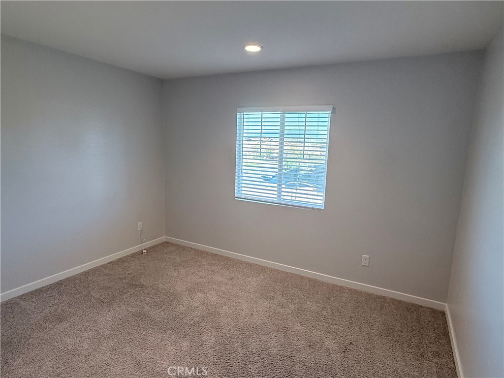31124 Hanover Lane Menifee, CA 92584 - Photo 39 of 58 an empty room with a window