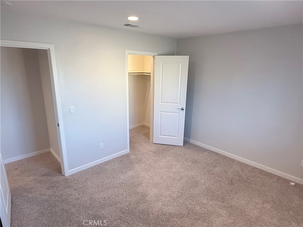 31124 Hanover Lane Menifee, CA 92584 - Photo 40 of 58 an empty room with closet area