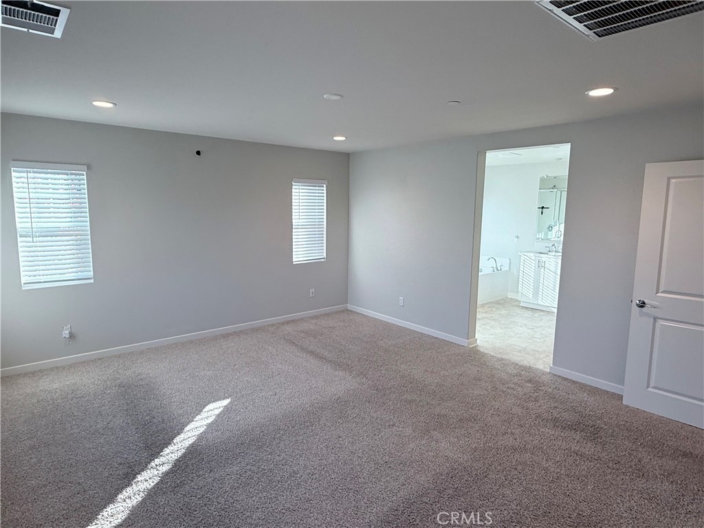 31124 Hanover Lane Menifee, CA 92584 - Photo 51 of 58 a view of an empty room with a window